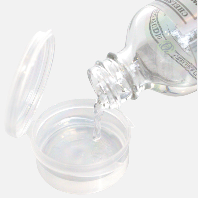 Masterson Solvent Cup with solvent being poured