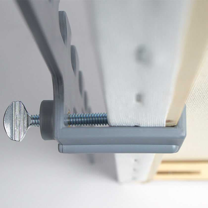 universal clamp on the stedi rest connecting to canvas frame